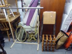 A BAR STOOL, CLOTHES RAIL, WINE RACK, A SMALL RUG AND AN OVAL GILT FRAMED MIRROR (5)