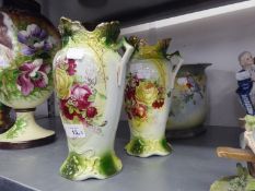 A PAIR OF VICTORIAN POTTERY TWO HANDLED VASES PRINTED WITH BOUQUETS OF FLOWERS, 9 ½? HIGH AND A