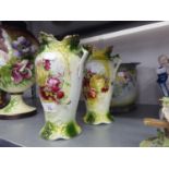 A PAIR OF VICTORIAN POTTERY TWO HANDLED VASES PRINTED WITH BOUQUETS OF FLOWERS, 9 ½? HIGH AND A