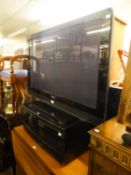 PIONEER 41? FLAT SCREEN TELEVISION, ON AN EBONISED CUPBOARD STAND AND A VIDEO RECORDER