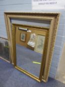 A LARGE OBLONG WALL MIRROR, IN FLORAL EMBOSSED GILT FRAME, 2?4? X 3?4? AND A LARGE EMPTY PICTURE