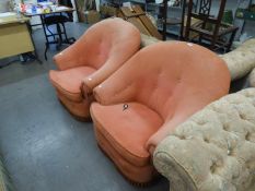 A PAIR OF TUB SHAPED SCOOP BACKED LOUNGE CHAIRS, BUTTON UPHOLSTERED AND COVERED IN PINK FABRIC