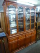 A LARGE CHERRY-WOOD DISPLAY CABINET, THE UPPER SECTION HAVING FOUR GLAZED DOORS, THE LOWER SECTION
