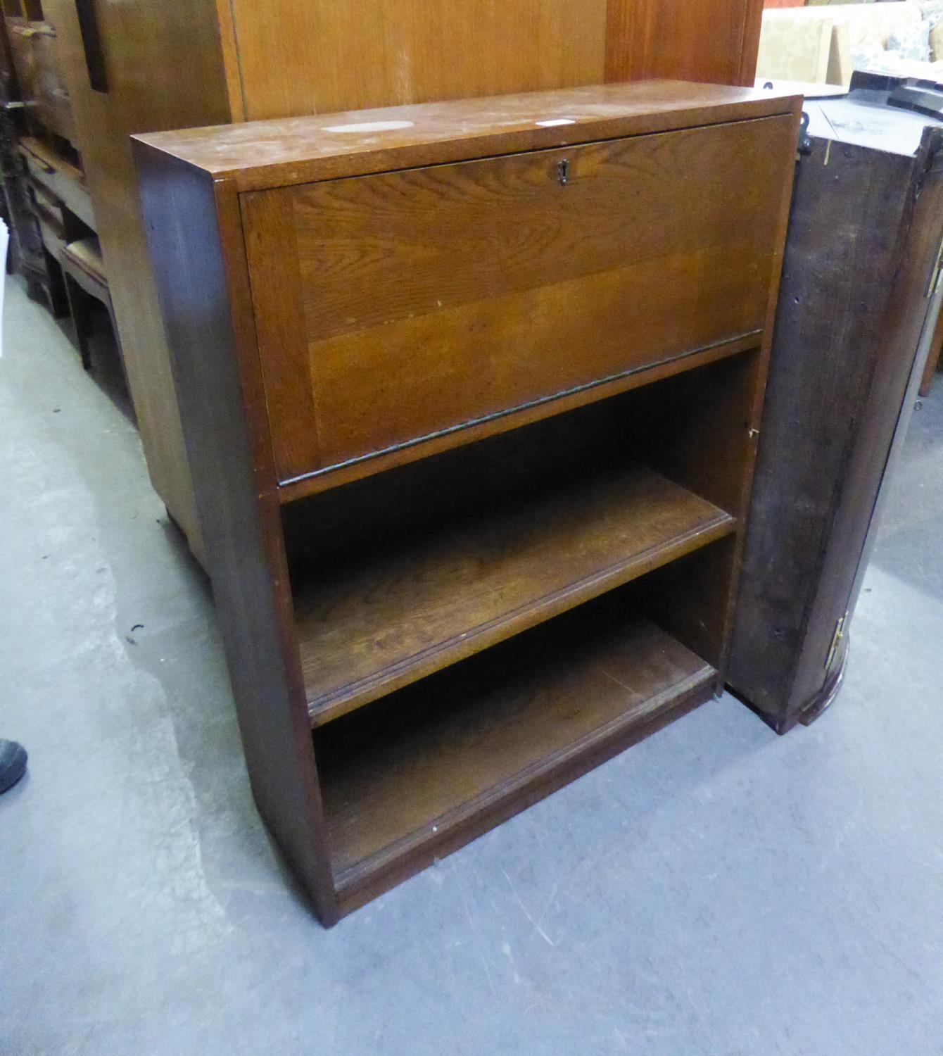 AN OAK BUREAU WITH UPRIGHT FALL-FRONT, TWO OPEN BOOKSHELVES BELOW, 2?6? WIDE