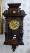 EARLY TWENTIETH CENTURY DARK STAINED WOOD 'VIENNA' WALL CLOCK, OF TYPICAL FORM WITH ARCHITECTURAL