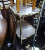 A GILT METAL SMALL TWO-TIER TEA TROLLEY AND A SMALL OBLONG MIRROR (2)