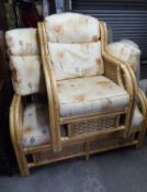 A BAMBOO AND WICKER CONSERVATORY SUITE, VIZ A TWO SEATER SETTEE AND A WINGED ARMCHAIR