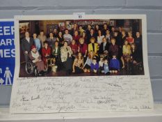 A LARGE COLOUR PHOTOGRAPH OF THE WHOLE CAST OF ?CORONATION STREET?, THE PANEL BELOW AUTOGRAPHED BY