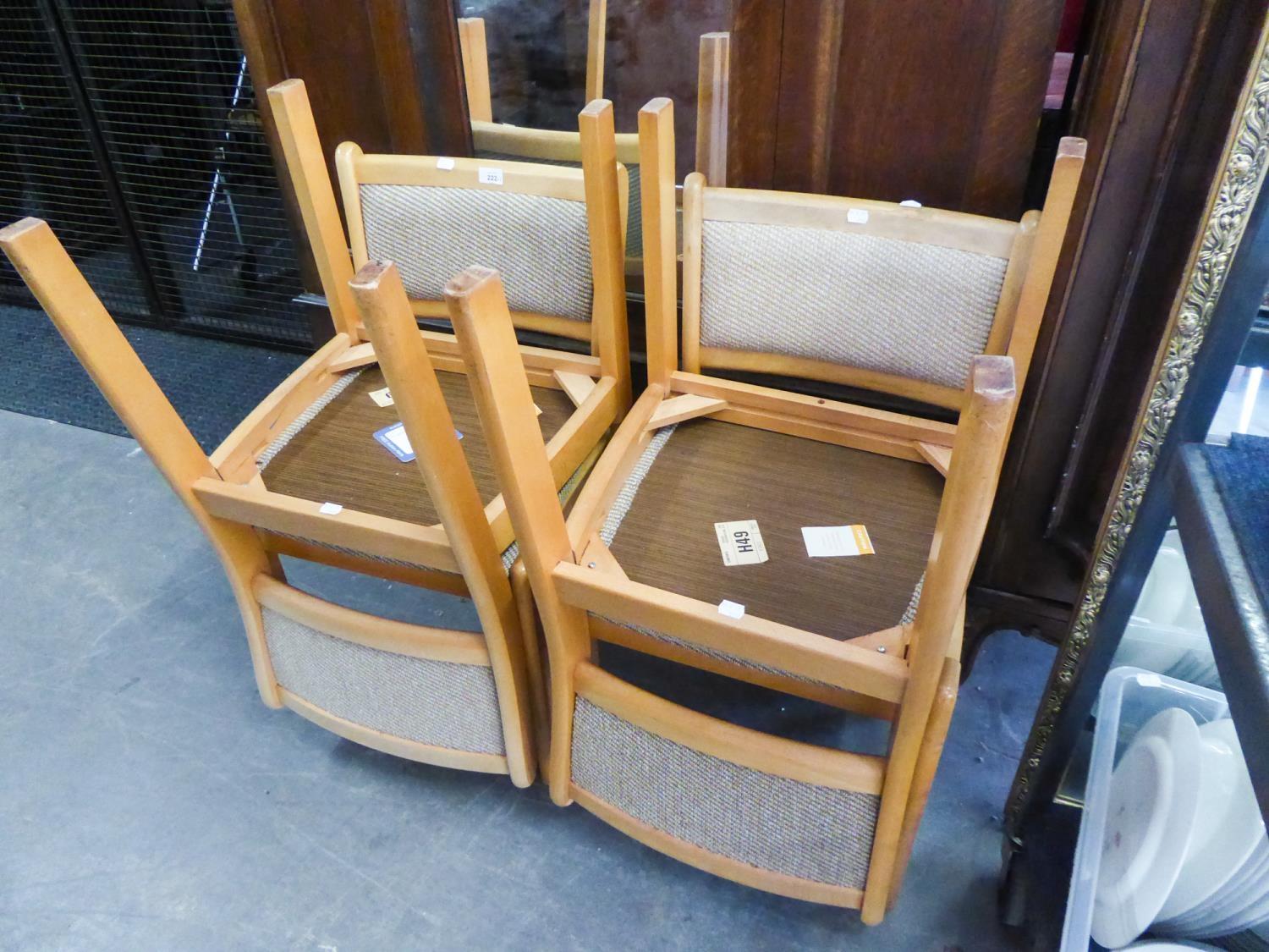 A SET OF SIX LIGHT BEECH WOOD DINING CHAIRS WITH UPHOLSTERED BACKS AND SEATS