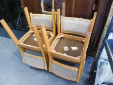 A SET OF SIX LIGHT BEECH WOOD DINING CHAIRS WITH UPHOLSTERED BACKS AND SEATS