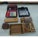 TRAVELLER'S MINIATURE CHESS AND DRAUGHTS SET, IN ZIP LEATHER CLOTH CASE; A SIMILAR CHESS SET WITH