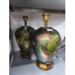A PAIR OF DECORATED METAL OVULAR VASE TABLE LAMPS AND FABRIC SHADES