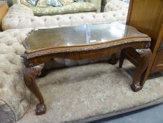 A BURR WALNUTWOOD QUEEN ANNE STYLE COFFEE TABLE, WITH GLASS INSET TOP, RAISED ON FOUR SHAPED LEGS