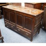 EIGHTEENTH CENTURY OAK MULE CHEST, the part hinged, moulded oblong top above a front with four