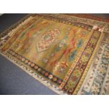 NEW ZEALAND, WOOL, MACHINE WOVEN BORDERED RUG of Caucasian design, having central medallion with