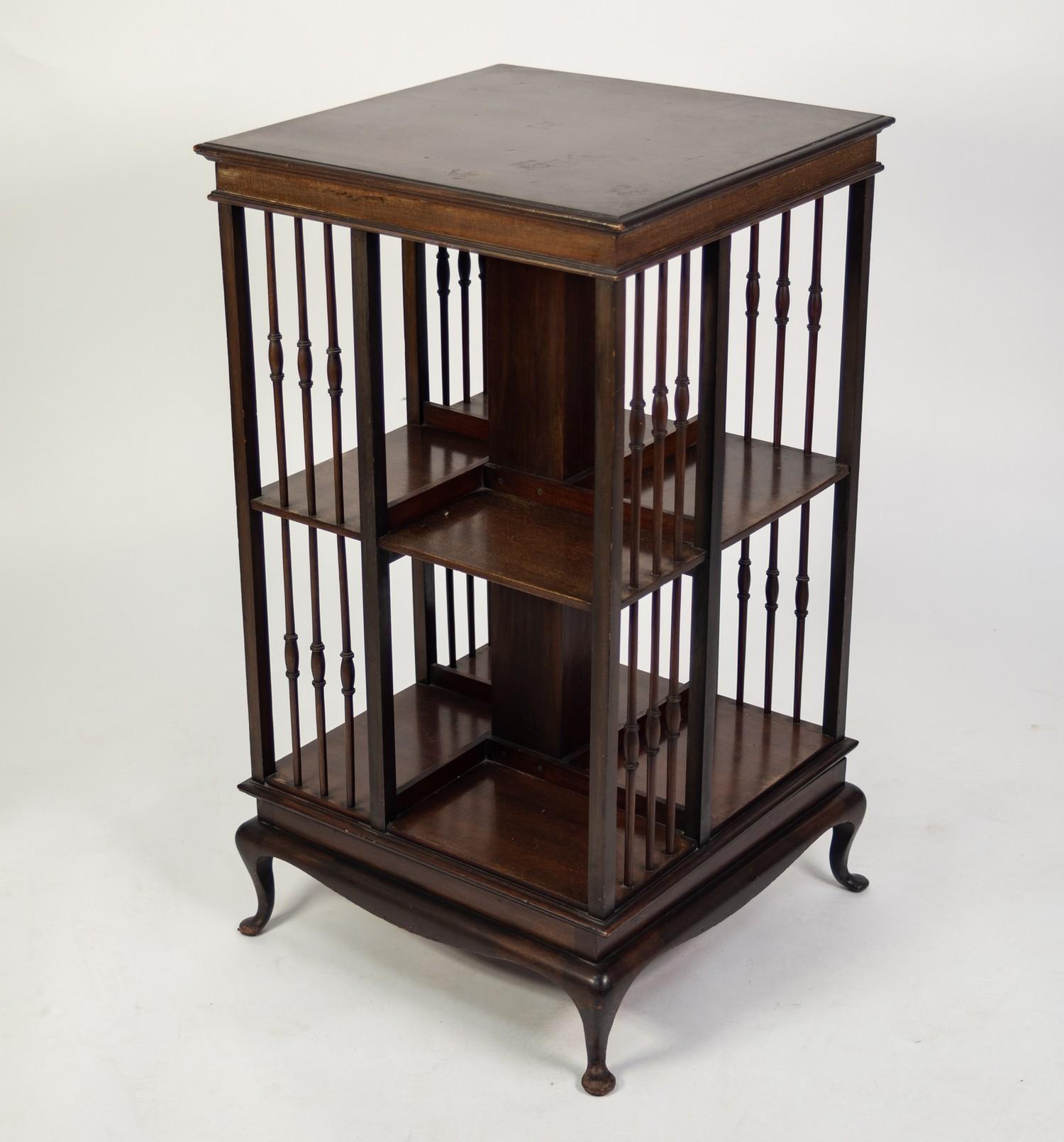 EARLY TWENTIETH CENTURY DARK MAHOGANY REVOLVING BOOKCASE, of typical form with slender, turned