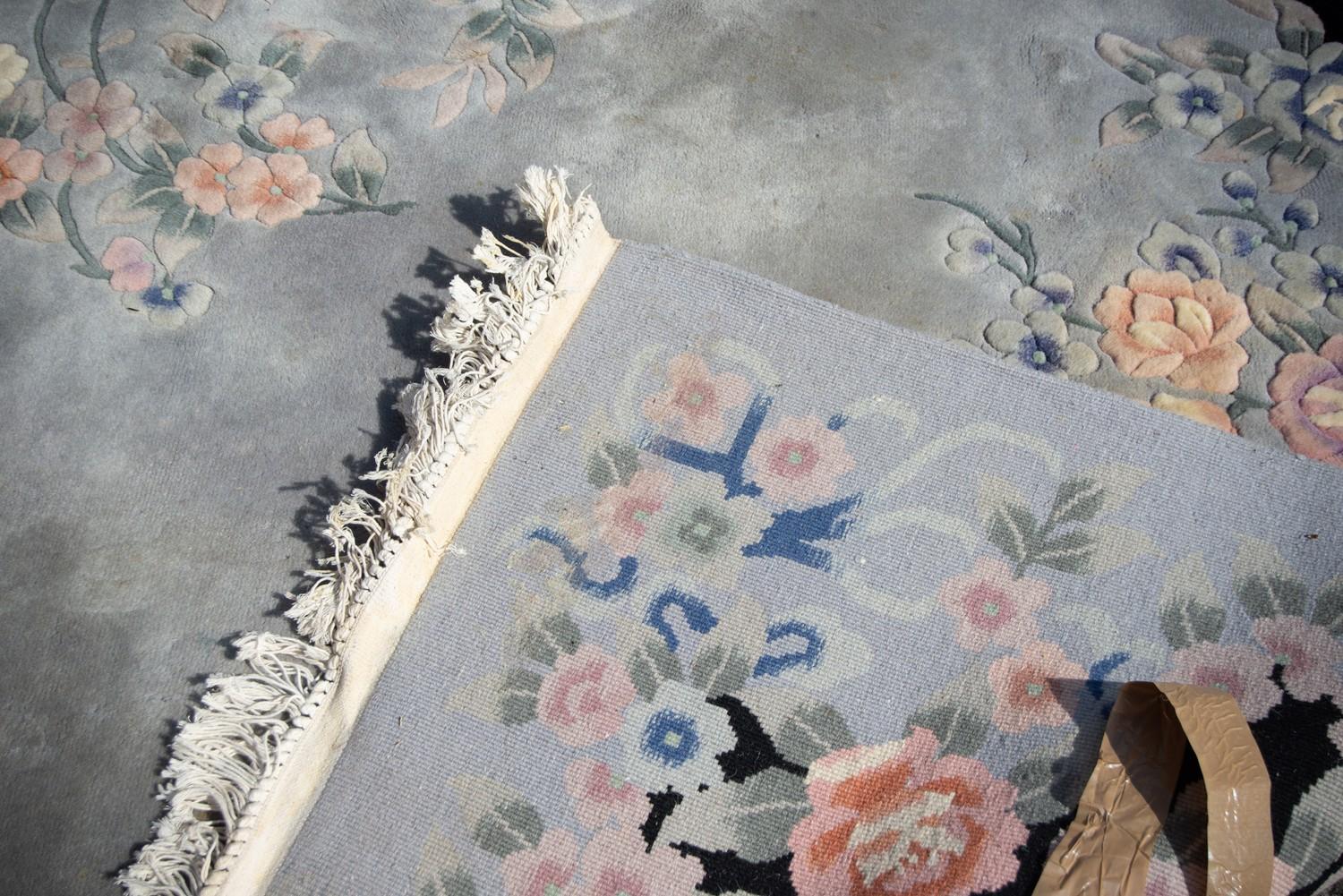 LARGE WASHED CHINESE CARPET, with a plain pale blue/grey field, embossed oval floral centre - Image 3 of 3