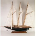 POST-WAR PROPRIETORY PAINTED WOOD MODEL OF A THREE MASTED AND STEAM POWERED SCHOONER, with fabric