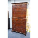 LATE GEORGIAN MAHOGANY CHEST ON CHEST, the moulded cornice above a veneered frieze and two short and