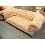 LATE VICTORIAN CHESTERFIELD THREE SEATER SETTEE button upholstered in heavy pink and floral fabric