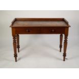 LATE VICTORIAN MAHOGANY WRITING TABLE, the moulded oblong top with three quarter gallery and gilt