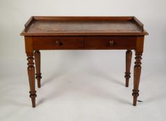 LATE VICTORIAN MAHOGANY WRITING TABLE, the moulded oblong top with three quarter gallery and gilt