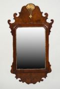 EARLY 20th CENTURY GEORGIAN REVIVAL WALNUT AND PARCEL GILT VERTICAL WALL MIRROR, the plate within