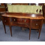 EARLY NINETEENTH CENTURY MAHOGANY AND LINE INLAID SERPENTINE FRONTED SIDEBOARD, the shaped top
