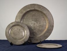 ANTIQUE PEWTER CHARGER, with broad rim, 17? (43.2cm) diameter, together with a PAIR OF ANTIQUE