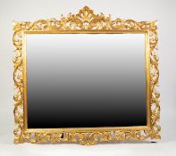 MODERN HARRISON & GIL LARGE BEVELLED WALL MIRROR, in carved gilt wood foliated scroll and pierced