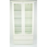 PETER CARLSON INTERIORS WHITE FINISH DISPLAY CABINET, the pagoda top above a pair of glazed cupboard