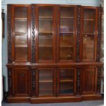 IMPRESSIVE NINETEENTH CENTURY CARVED MAHOGANY BREAKFRONT LIBRARY BOOKCASE, the four glazed