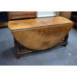 EIGHTEENTH CENTURY OAK DOUBLE GATE LEGGED DINING TABLE, the oval top o block and turned supports, 28