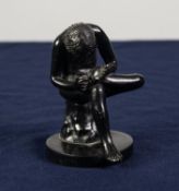 SMALL ITALIAN SPELTER FIGURE AFTER THE ANTIQUE, depicting a naked male athlete seated to remove a