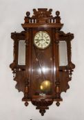 EARLY TWENTIETH CENTURY WALNUT CASED VIENNA WALL CLOCK WITH ADDITIONAL/ LATER SIDE PIECES, the clock