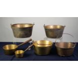 FOUR BRASS JAM PANS with cast iron swing handles, 11? (28cm) diameter and smaller, together with TWO