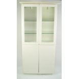 PETER CARLSON INTERIORS WHITE FINISH DISPLAY CABINET, the pagoda top above a pair of glazed cupboard