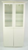 PETER CARLSON INTERIORS WHITE FINISH DISPLAY CABINET, the pagoda top above a pair of glazed cupboard