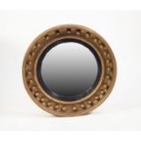 19th CENTURY GILT CONVEX MIRROR, the circular cavetto frame applied with balls and with an