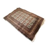 FINELY KNOTTED PAKISTAN BOKHARA RUG, with silky pile and four rows of hexagonal pale blue guls, each