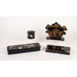 ORIENTAL BLACK LACQUERED PAPIER MACHE LETTER HOLDER, gilt printed with court figures, on an oblong