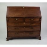 GEORGE III MAHOGANY LARGE BUREAU, of typical form, the interior well fitted with short drawers and