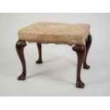 ANTIQUE EARLY GEORGIAN REVIVAL WALNUT DRESSING OR FOOTSTOOL, the stuff-over seat above cabriole