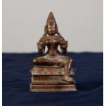 FAR EASTERN BRONZE MODEL OF KALI seated in a traditional pose, on high oblong base, 3 1/2in (8.