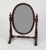 GOOD EARLY NINETEENTH CENTURY CARVED MAHOGANY LARGE TOILET MIRROR, the oval plate within a moulded