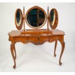 LOUIS XV STYLE MAHOGANY STAINED DRESSING TABLE, of serpentine outline with three drawers and