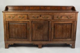 NINETEENTH CENTURY OAK DRESSER, the moulded oblong top with six drawers to the low gallery back, set
