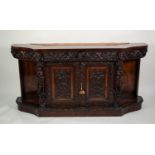 LATE NINETEENTH CENTURY BELGIAN HEAVY CARVED WALNUT SIDE CABINET, grained painted as rosewood, the