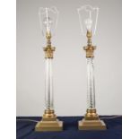 LARGE PAIR OF BRASS AND SPIRAL MOULDED CLEAR GLASS TABLE LAMPS, each of Corinthian column form
