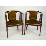 PAIR OF EDWARDIAN INLAID MAHOGANY TUB SHAPED DRAWING ROOM ARMCHAIRS, each with gold velvet back